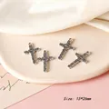 Macro detail of a 15x26mm vintage alloy cross charm with intricate hollow patterns for DIY - Cross Style 13 / Antique Silver
