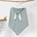 Close-up of light blue cotton muslin baby hooded towel with white rabbit ears on hanger - 75x75cm / Bean Green