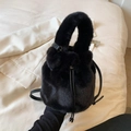 Chic black faux fur bucket bag with drawstring closure and leather crossbody strap - Black
