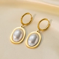 Elegant 18K gold-plated titanium earrings with large oval grey pearls on silk fabric - Oval Grey Pearl Huggies / Gold