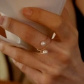 Elegant gold-tone adjustable open ring featuring two white pearls on a spiral band - Gold Imitation Pearl Coil