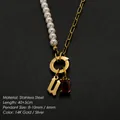 14K gold plated stainless steel pearl necklace with initial U and red gemstone pendant - Gothic Letter U