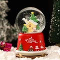 Christmas musical snow globe with red base, train pattern and Santa Claus scene - Christmas House (260) / 8cm Music + Light