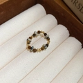Detailed close-up of beaded ring with tiger eye stones and gold beads on velvet - 31# Tiger Eye and Dalmatian Stone Beaded Ring