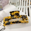 Large acetate hair claw clip featuring yellow and black tortoiseshell pattern in rectangular shape - Yellow Black Tortoiseshell