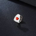 Silver hip hop grillz featuring a vibrant red heart-shaped gemstone center piece - Red Zircon Heart / Silver