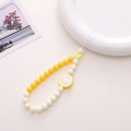 Yellow beaded phone charm strap with a large smiley face pendant and small heart charm - K1063 Smiley Phone Chain Yellow