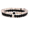 Close-up of 8mm matte black agate and white dragon vein stone distance bracelets - Dragon Vein Agate Style