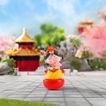 Tang Dynasty girl tumbler figurine with yellow robe and pink lotus flower decoration - Small-Holding Lotus