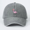 Detail of pink flamingo embroidery on washed gray cotton fabric of the baseball cap - One Size / Gray