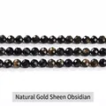 Faceted natural gold obsidian beads showing shimmering golden cat-eye effect on white base - 7A Natural 96-Faceted Golden Obsidian 6mm/Approx 60pcs