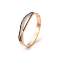 Detail of rose gold bangle with interlaced lines and black and white zirconia stones - Rose Gold (B2199-RG)