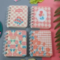 Set of four mini A7 spiral notebooks featuring pink and orange tulip floral illustrations - Smiley