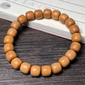 Bamboo-style sandalwood beaded bracelet with natural wood grain on a vintage background - Sandalwood 8x9mm Classic Beads Single Loop