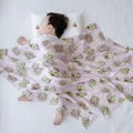Bamboo cotton muslin swaddle blanket featuring a pink artichoke floral pattern for babies - Taro Purple