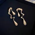Macro shot of liquid metal irregular wave earrings with silver mirror finish on box - 8# Silver Needle-Silver Irregular Teardrop-Liquid Metal