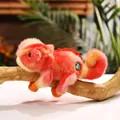 Cute chameleon plush toy in orange and yellow gradient fur resting on a wood branch - Orange Red / 20cm
