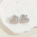 Silver-plated heart earrings with woven texture detail on natural stone surface - Textured Heart Earrings / Platinum Color