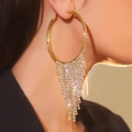 Golden oversized crystal hoop earrings with rhinestone tassels shown on model - Hoop Tassel / Gold Tassel DTE1916131GL