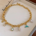 Golden starfish ocean necklace with turquoise fish tail and baroque pearl charms - Gold Starfish Conch Turtle Multi Pendant Necklace