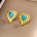 Close-up of vintage heart earrings with turquoise stones in gold textured setting - Gold Dark Blue Turquoise E-246