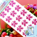 Macro detail of pink acrylic crystal stickers in flower shapes for DIY decoration - Butterfly Rose Red