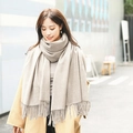 Thick beige cashmere scarf with tassels, styled on a model for a cozy winter look - 200*70cm / Velvet-Touch Tassel Style / Beige