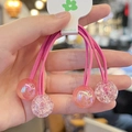 Detailed view of pink double-strand hair tie with four decorative candy glitter balls - Rose Red