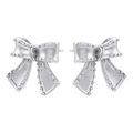 Macro detail of silver bow earrings with textured grainy finish and polished metal shine - Bow Stud Style (White Gold Color)