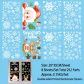 Detail showing 8 sheets of double-sided Christmas window clings with Santa and snowflakes - Peeking Santa and Elk