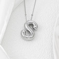 Macro shot of puffy balloon letter S pendant with silver polished finish on beaded chain - Letter S Pendant