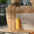 Realistic PVC crinkle-cut French fries keychain charm on a plush bag, 13g weight - Crinkle Cut Fries