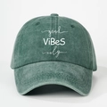 Detailed view of the embroidered Good Vibes Only text on washed vintage cotton baseball cap - One Size / Dark Green