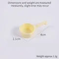 Miniature pale yellow 4cm plastic ladle toy for dollhouse kitchen and role play sets - Yellow