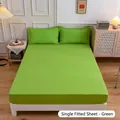 Modern grass green fitted bed sheet and matching pillowcases in minimalist bedroom decor - Green
