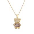 Detail of teddy bear pendant with purple gemstones and crystals on golden chain - Purple
