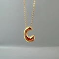 Detailed close-up of golden alphabet C pendant necklace on a sleek O-chain link - Letter C Single Pendant