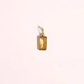 Rectangular gold stainless steel pendant with yellow zircon stone on pink background - April (Gold)