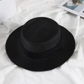 Flat lay of a black straw boater hat with a matching ribbon bow on white fabric - M (56-58cm) / Black