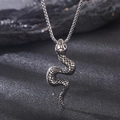 Macro shot of silver snake pendant with scale texture on a punk rock style chain - Steel Color Snake Necklace With Chain (KN230408-Z)