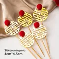 5-piece gold Xi character cake toppers with red pom-poms for Chinese weddings - Gold Metal Double Happiness 5Pcs