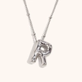 Macro detail of 3D balloon initial R pendant necklace in polished silver finish - Steel-R