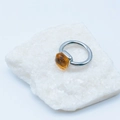 Silver stainless steel ring featuring a geometric faceted yellow gemstone on white crystal - Silver Base: Jul-Champagne