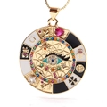 Detail of a golden coin pendant featuring a colorful evil eye and lucky symbols - 05
