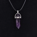 Natural purple quartz point pendant necklace with silver metal cap on black silk background - Amethyst