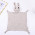 Detail of soft beige cotton gauze baby comforter with cute rabbit head and knotted corners - 30*30 cm / Khaki
