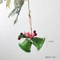 Green Christmas iron bells with red plaid bow, pine needles and berries hanging on twine - Green Double Bells