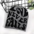Grey and black jacquard knit beanie featuring Love Never Fails slogan design - One Size / Gray