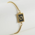 Gold box chain bracelet featuring a black enamel pendant with letter O and beaded border - O-Black