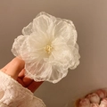 Elegant white fabric flower hair clip made of layered organza for a summer beach look - Camellia Hair Clip Off White